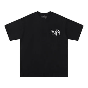 https://cdn.shopify.com/s/files/1/0901/0413/6028/files/amiri-logo-blackwhite-t-shirt-592594.jpg?v=1743988874